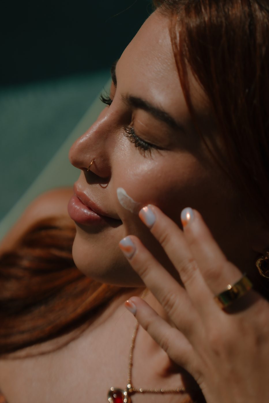 Alexis applying skincare as part of her own self-care ritual