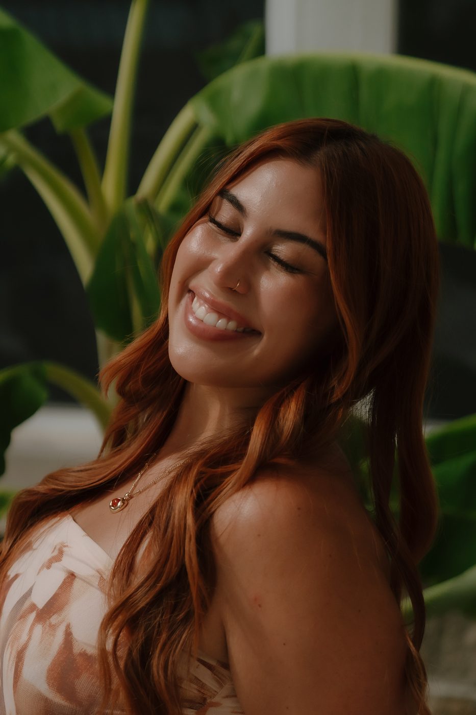 Alexis laughing candidly in the summer sun